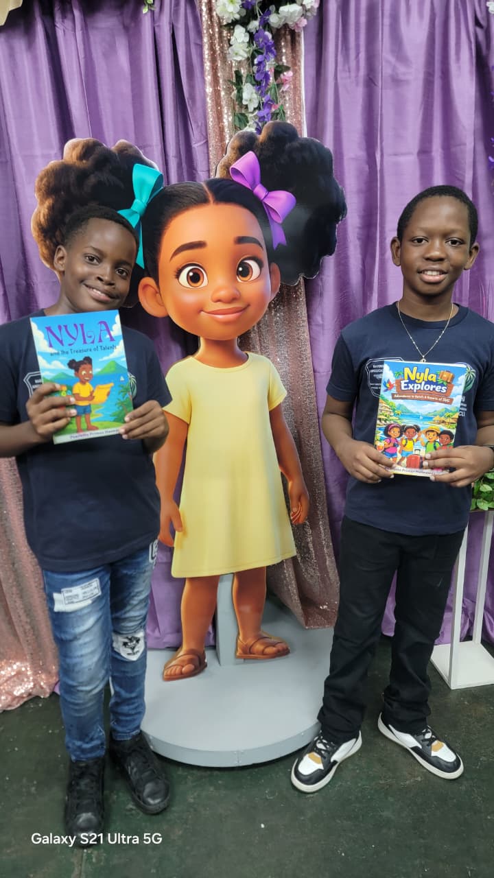 Young readers with Pearlette Primus Hannaway's Nyla books beside the life-size Nyla statue at the May 30 2026 book launch